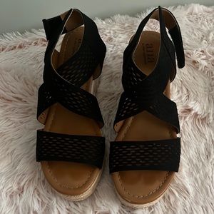 Wedge sandals! Black, with 2.5 inch wedge heel; adjustable Velcro strap.